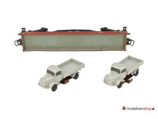 Marklin H0 4515 V03 Lageboordwagen 00t / Rklmm-tu van de DB beladen met 2 vrachtwagens - Modeltreinshop